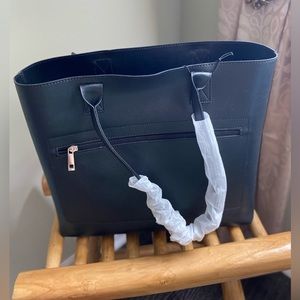 Bugatti laptop bag. Brand new with tags. Features removable laptop compartment.